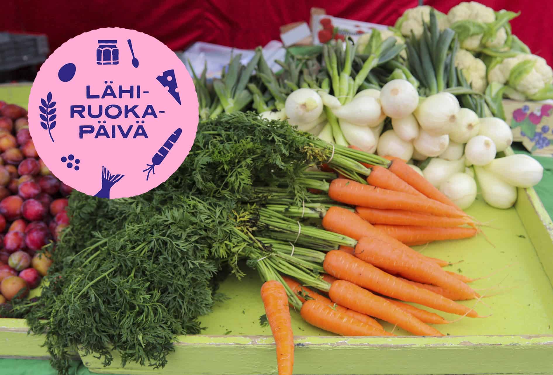 Porkkanoita ja sipuleja esillä. Lähiruokapäivän-logo vasemmassa yläkulmassa.